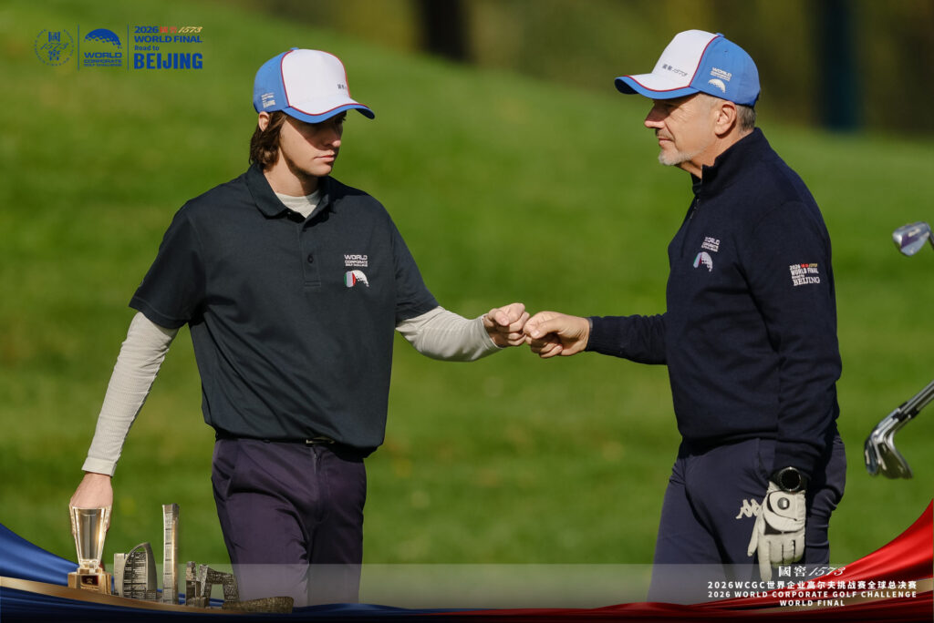 Teammates bump fists during the Greensome final round of the 2026 WCGC World Final