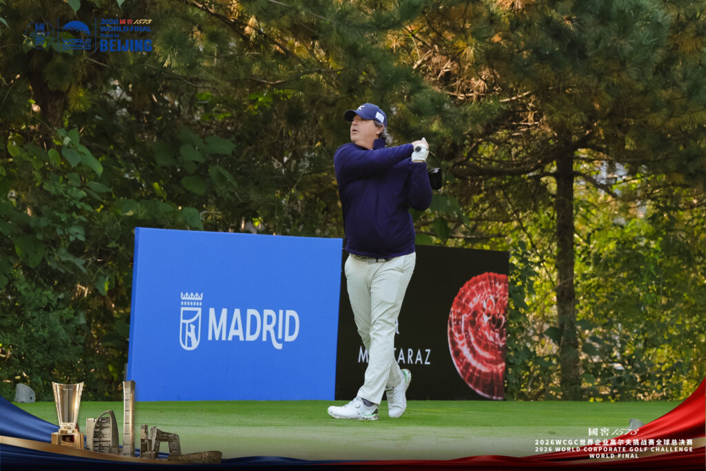 Player tees off in front of the Madrid branding during the Sports Legends Cup 2026