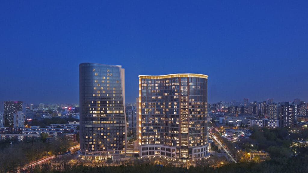 Hotel towers in Beijing lit at dusk
